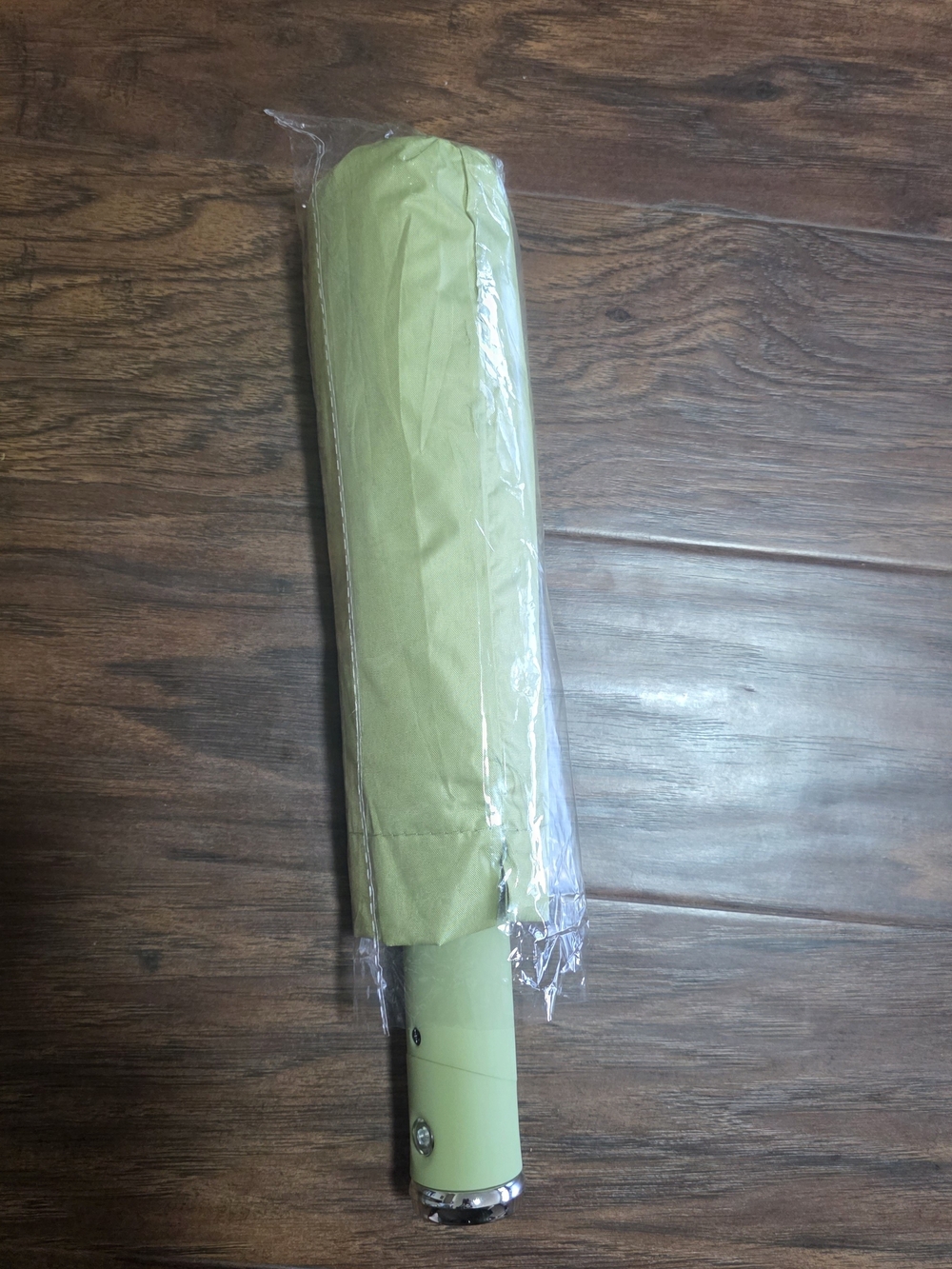 Green compact umbrella with light.